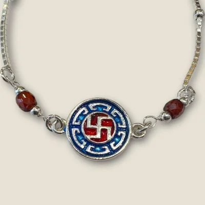 BEAUTIFUL SILVER RAKHI WIITH LOVELY SWASTIK DESIGN | SB78