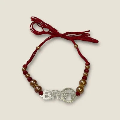 BEAUTIFUL SILVER THRED RAKHI WITH LOVELY DESIGN