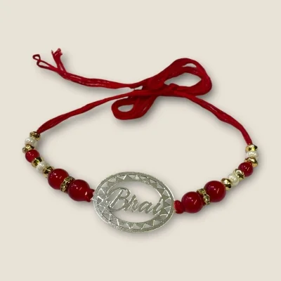 BEAUTIFUL SILVER THRED RAKHI WITH LOVELY DESIGN